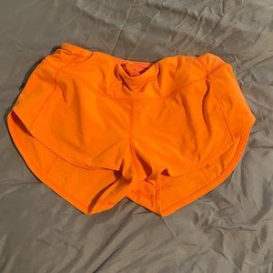 Neon orange 2.5 inch Lululemon low rise Speed Up shorts size 0